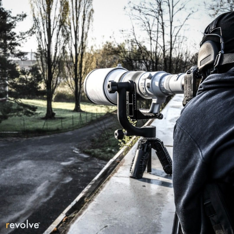 Load image into Gallery viewer, Spotting lens mounted on Revolve&#39;s Tactical Tripod and in use.
